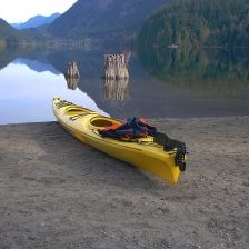 Kayak on the beach by the ocean